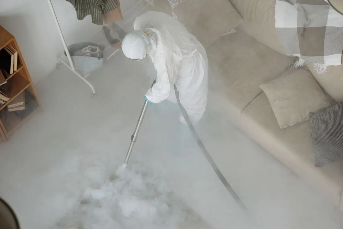 Biohazard cleanup technician in protective equipment, St. Martins Village, Lexington, KY